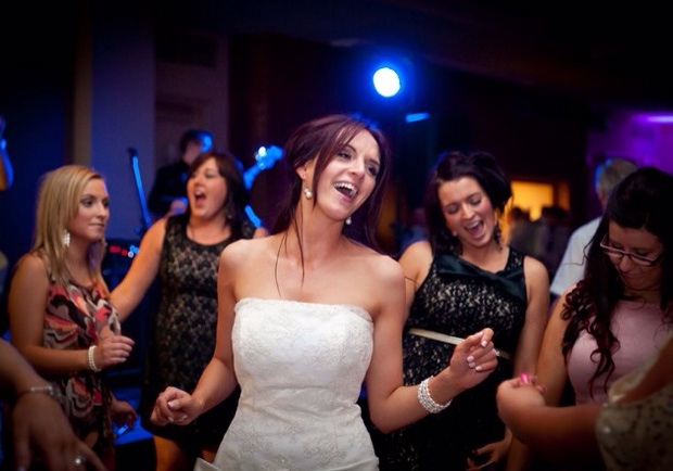 Bride dancing with bridesmaids