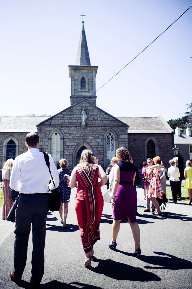 wedding guests gathered outside chruch