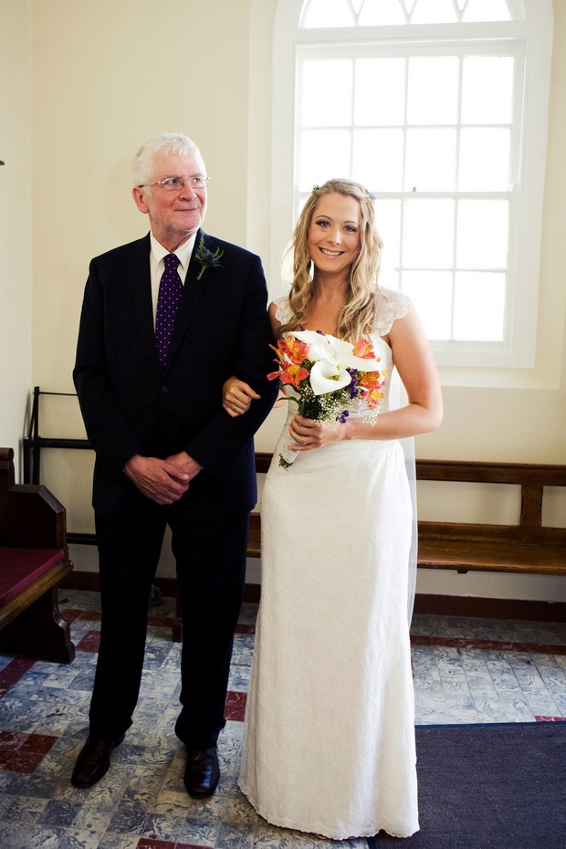bride and dad beginning to walk up aisle