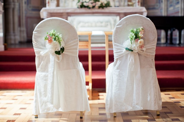 ceremony bride and groom chair back decor flowers