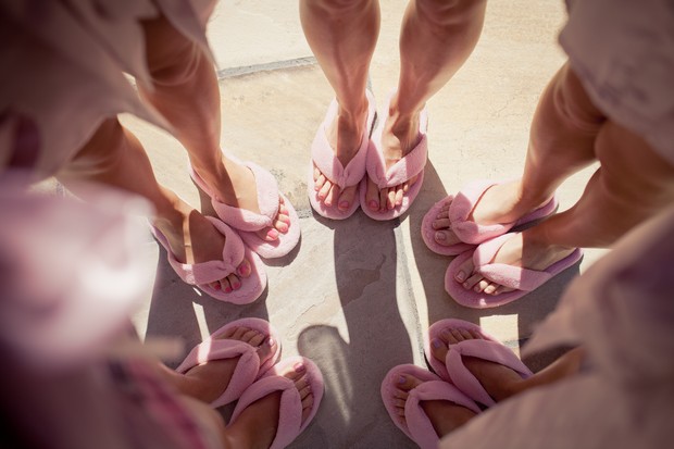 bridesmaids in pink slippers wedding morning