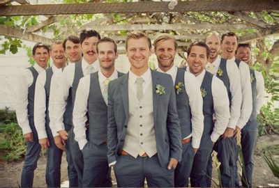 Groomsmen in green and mint wedding suits