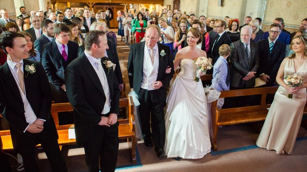 father of the bride giving away top of aisle