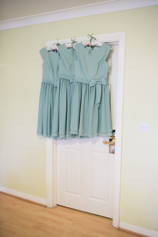 pastel green bridesmaids dresses hanging