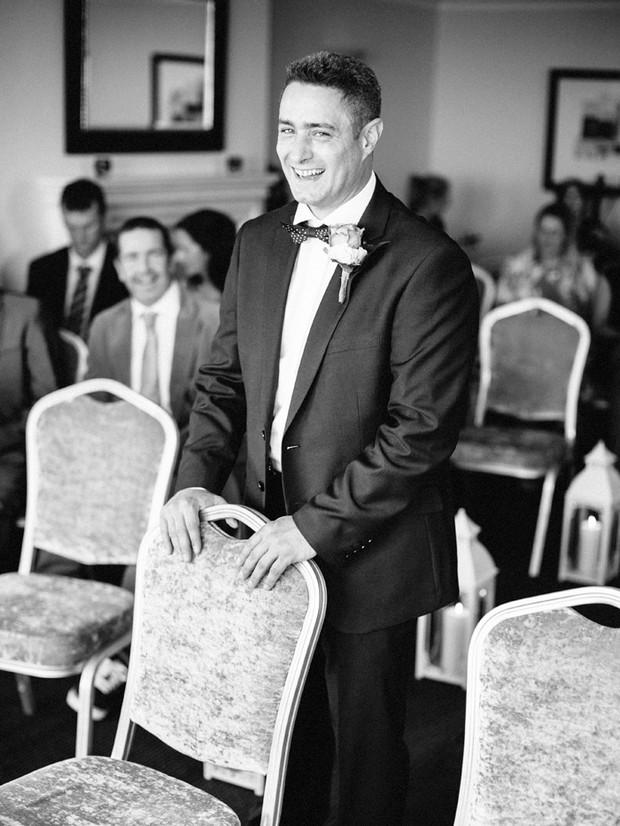 groom laughing wedding ceremony 
