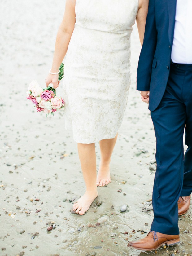 bride groom walking beach short dress