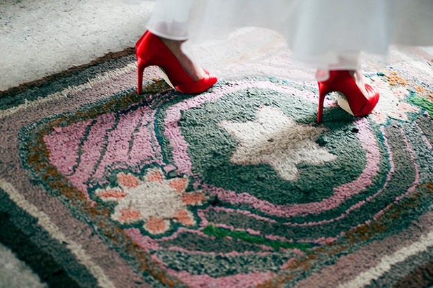 bride in red satin shoes