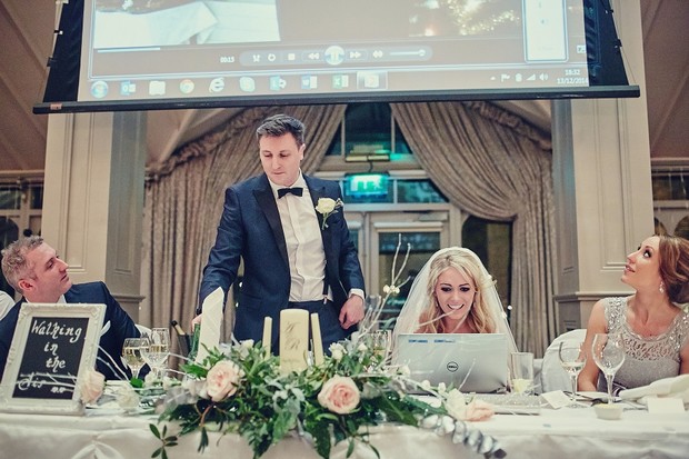 65-bride-watching-wedding-video-laptop