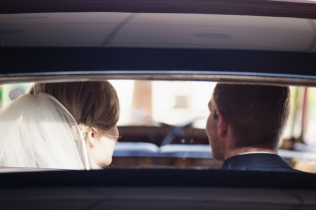 bride-and-groom-leaving-wedding-ceremony-car