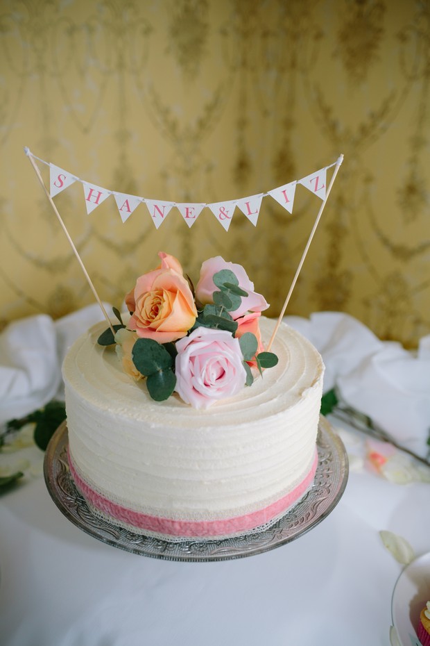 Single tier wedding cake trend bunting topper