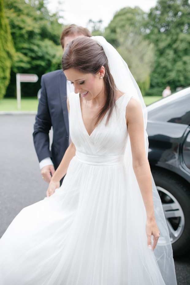 bride-getting-out-of-wedding-car