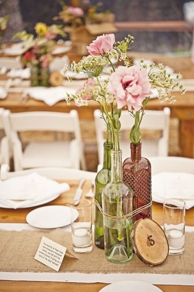 rustic-wedding-centerpiece-ideas-flower-filled-bottles-twine