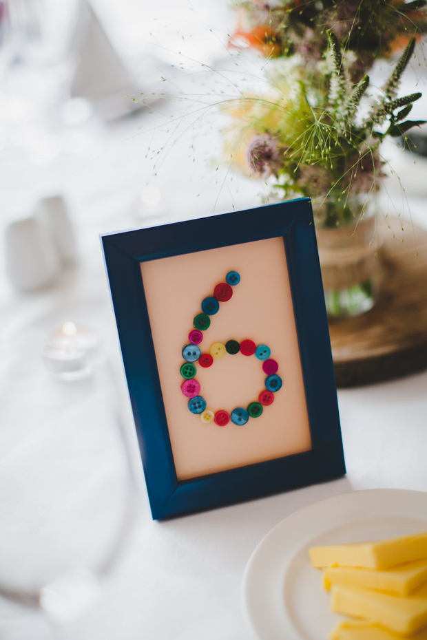 35-DIY-table-number-ideas-buttons-in-frame