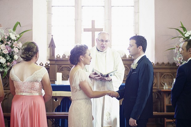 bride-groom-exchanging-vows-church-wedding