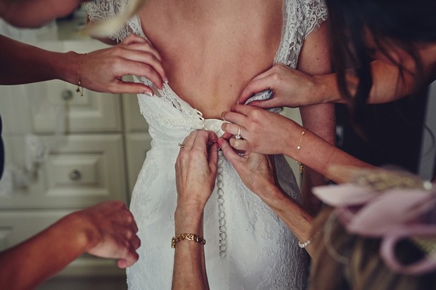 16-Hands-wedding-dress-fitting