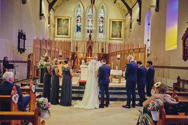 34-full-wedding-party-at-church-altar