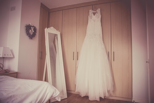 7_tulle_sophia_tolli_wedding_dress_hanging_real_bride