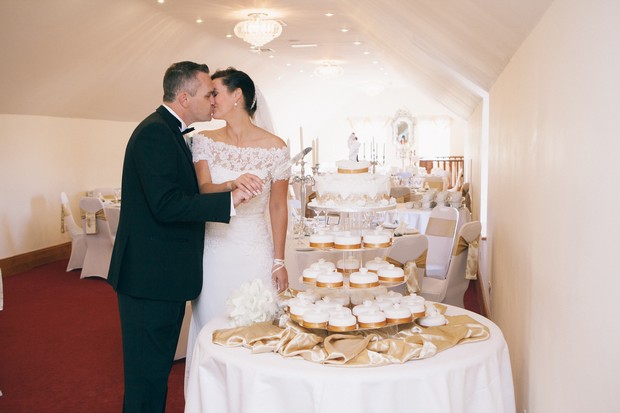 cupcake-wedding-cake-bride-and-groom-cutting-the-cake