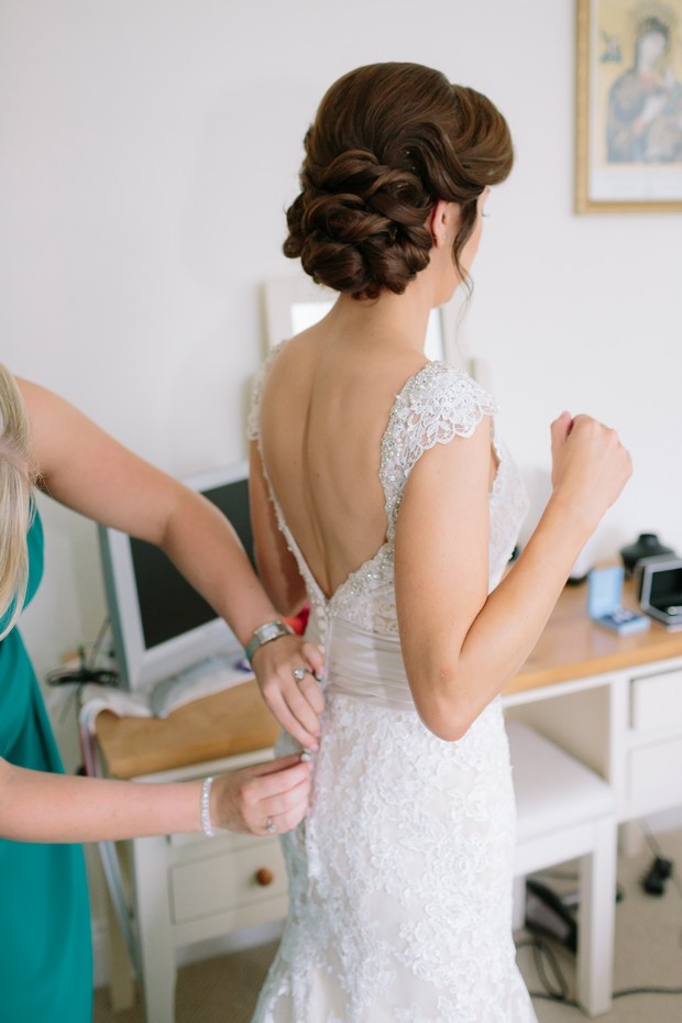 14-Bridesmaid-wedding-dress-fitting-buttons