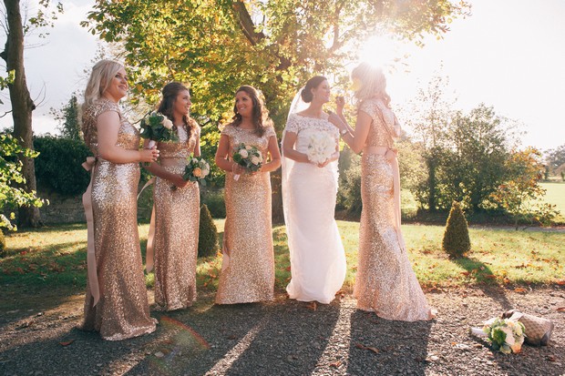 bridesmaids-in-gold-glittery-full-length-dresses-AidanBeatty