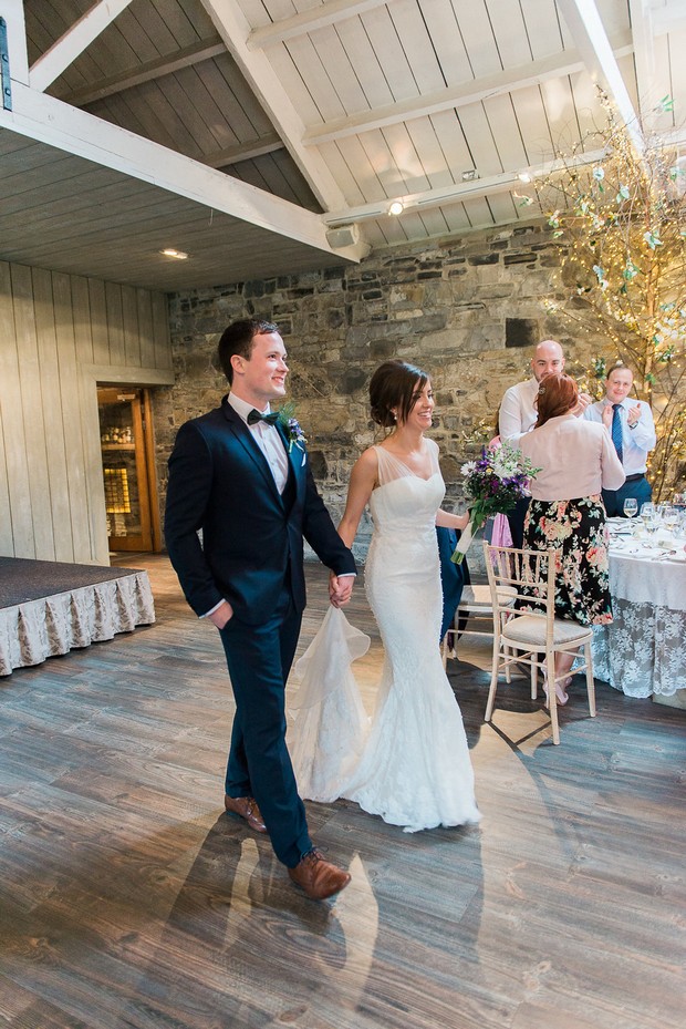 Bride-groom-reception-entrance-Ballymagarvey-Village-weddingsonline
