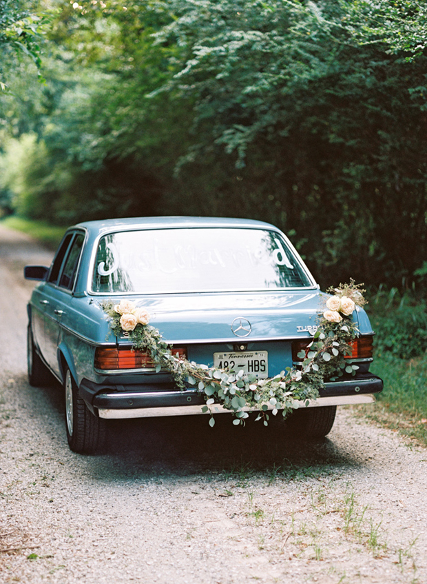 wedding-getaway-car-with-floral-garland