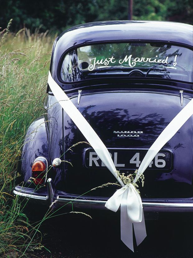 wedding-getaway-car-with-ribbon-bow