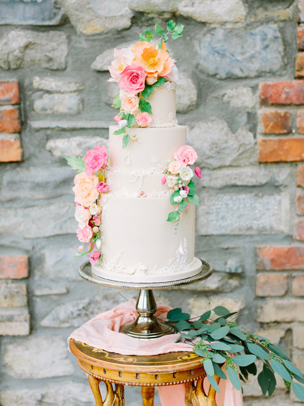 flower-adorned-three-tier-ivory-wedding-by-cupcakes-and-counting