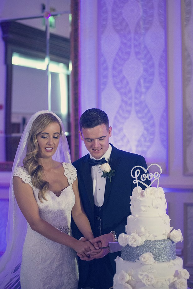 bride-and-groom-cutting-wedding-cake