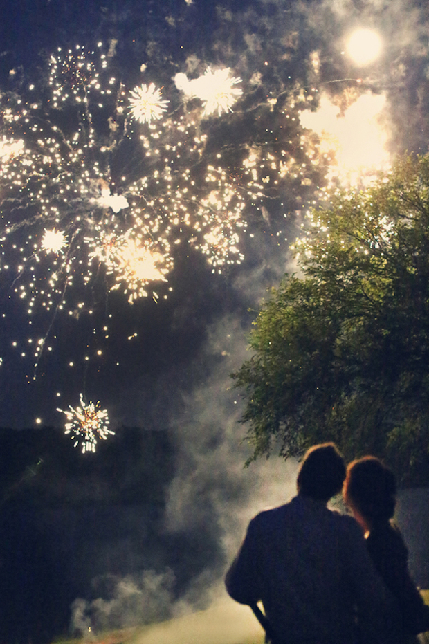 bride-and-groom-looking-at-wedding-fireworks