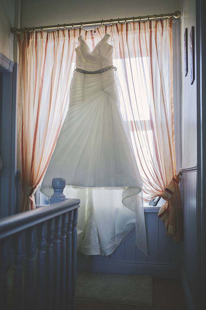 02-Brides-wedding-dress-hanging-weddingsonline