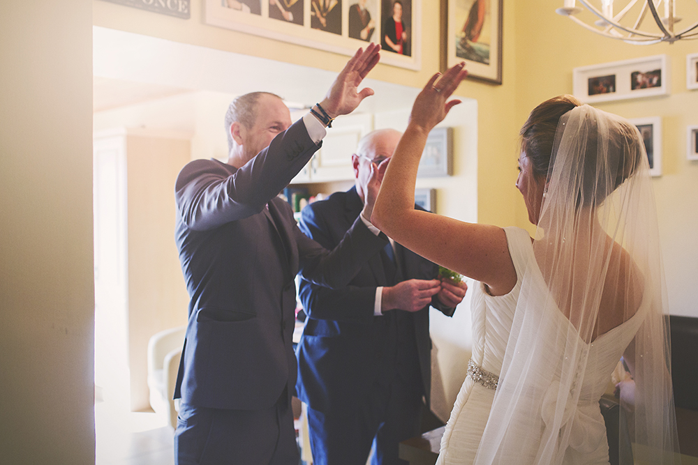 14-Bride-giving-high-five-weddingsonline
