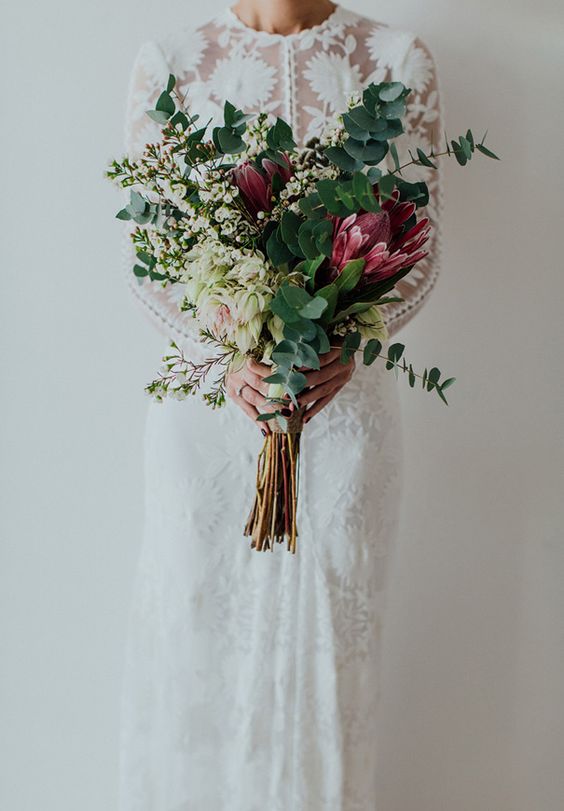 Winter-Wedding-Bouquets-Tall-Greenery-Purple-weddingsonline
