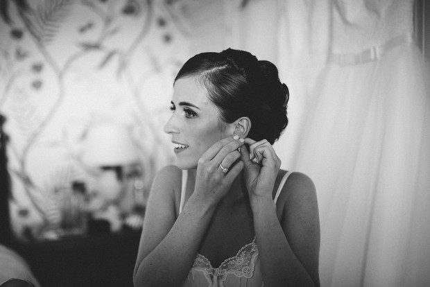 15-Bride-getting-ready-earrings-Emma-Russell-Photography-weddingsonline