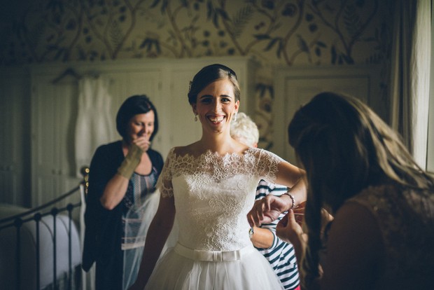 16-Bride-getting-ready-wedding-dress-Emma-Russell-Photography-weddingsonline
