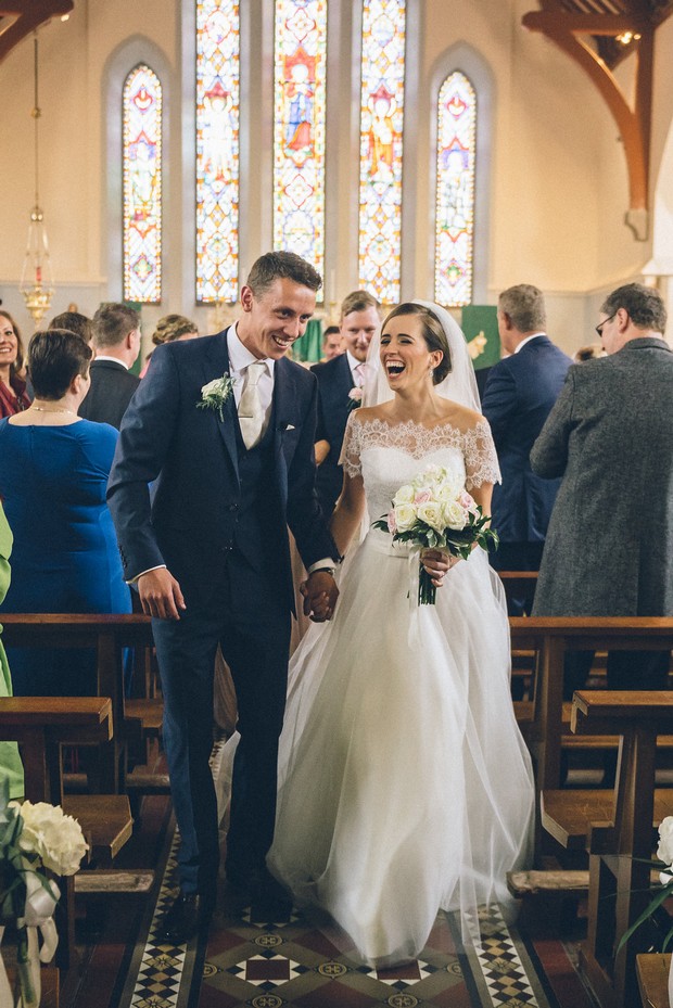 22-Bride-groom-walking-aisle-church-Emma-Russell-Photography-weddingsonline