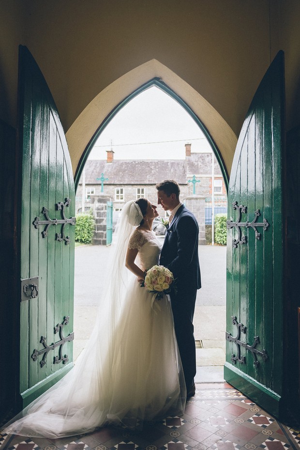 22-Bride-groom-wedding-photography-church-door-Emma-Russell-Photography-weddingsonline