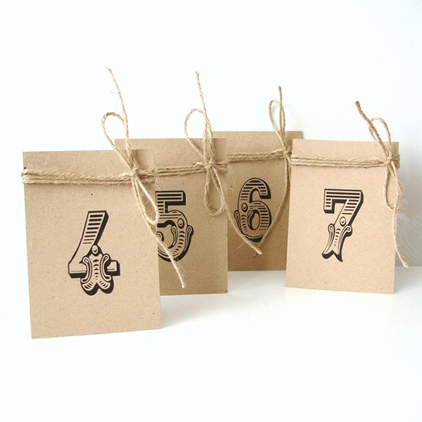 Simple brown card table numbers with jute bow