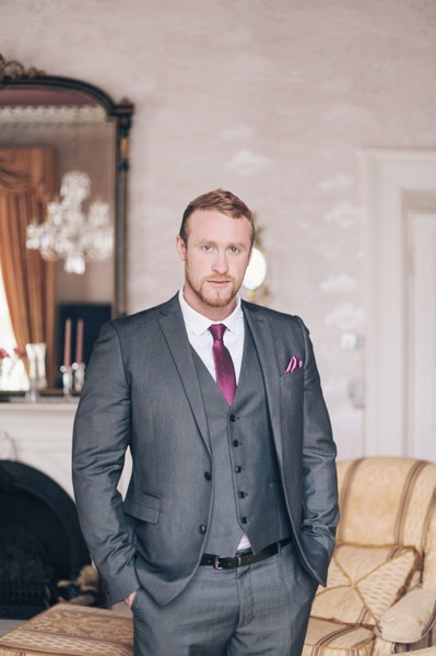 Groom with grey suit and pink tie