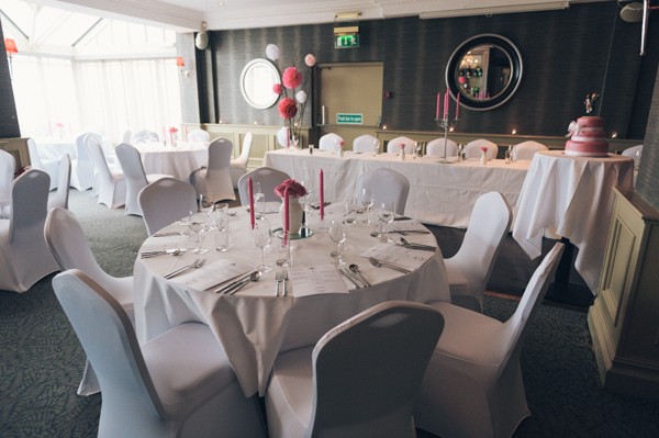 reception room with white chair covers