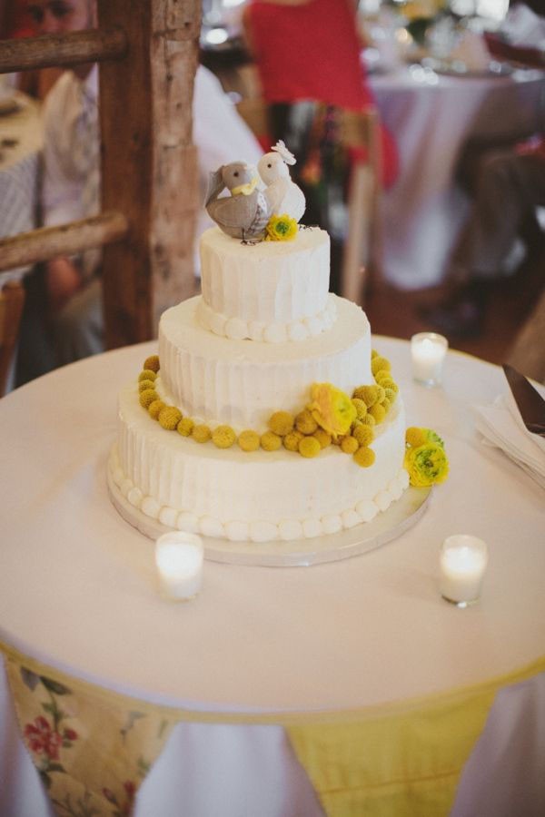 Love bird wedding cake with yellow accents