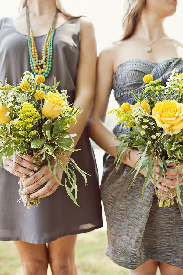 Grey maids carrying yellow bouquets