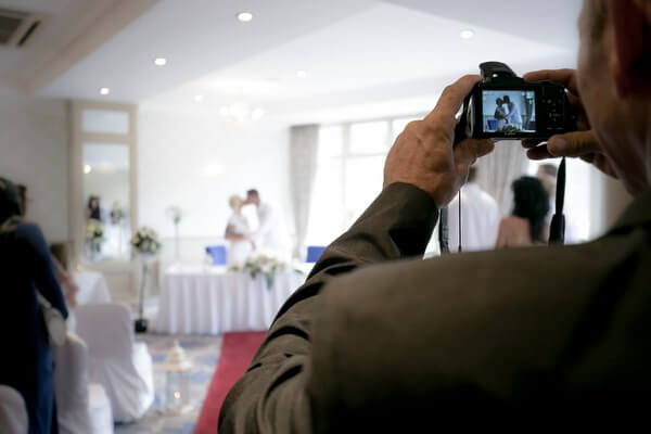 22-wedding-guest-taking-photo-digital-camera-mrs2be