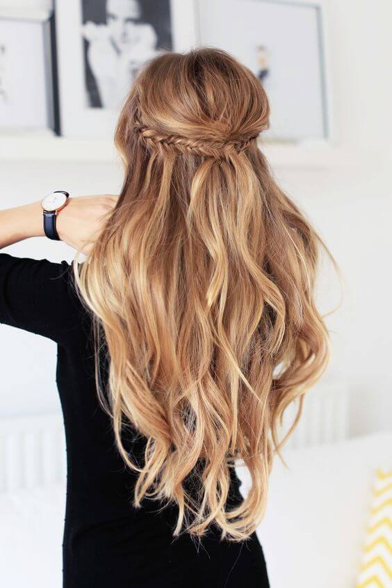 Image of Half up half down hairstyle with soft waves for wedding guest